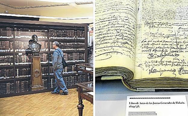 Vista parcial de la muesta, en la Sala Noble de la Biblioteca Foral. | Libro de actas de las Juntas de 1629 y dedicatoria de Echegaray en un texto sobre organización de archivos.