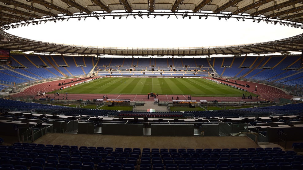 Estadio Olímpico de Roma. Roma y Lazio juegan en él sus partidos como local, si bien ambos planean construir sus propios feudos. Será sede de tres partidos del grupo A y de uno de la ronda de cuartos.