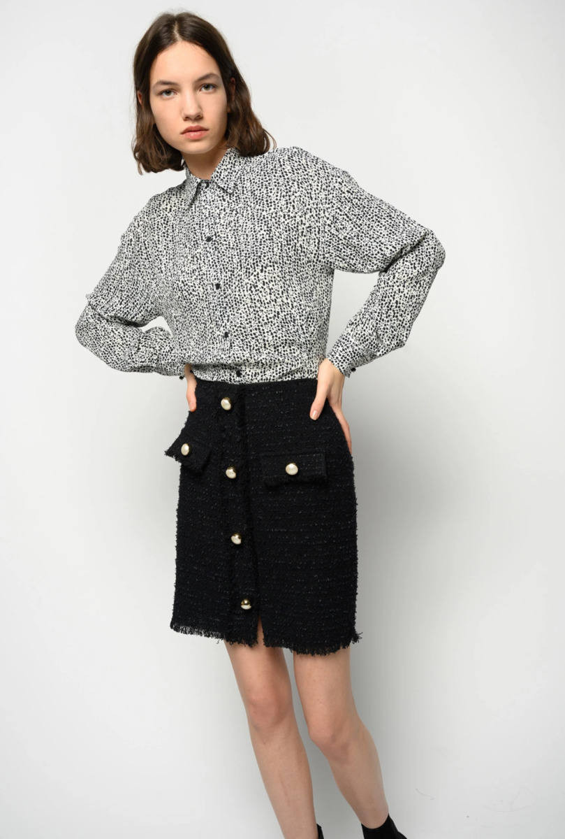 8. Minifalda de tweed negro de la tienda Lovehate, ubicada en la calle Elcano número 15. Cuesta 190 euros.