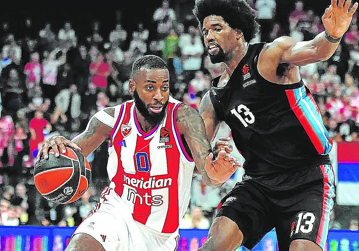 El exbaskonista Miller-McIntyre protege el balón ante Hayes en el estreno europeo en París .