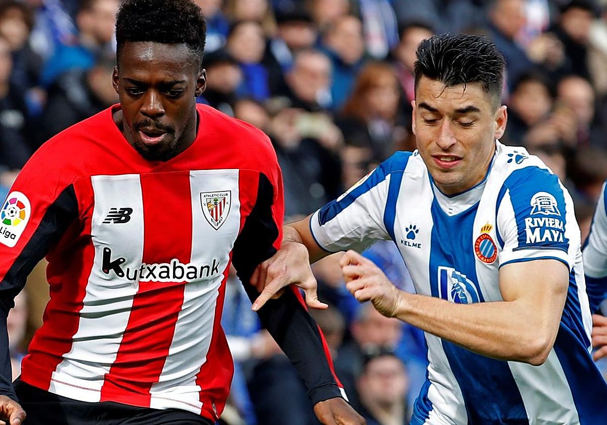 Iñaki Williams y Marc Roca en una acción del partido.