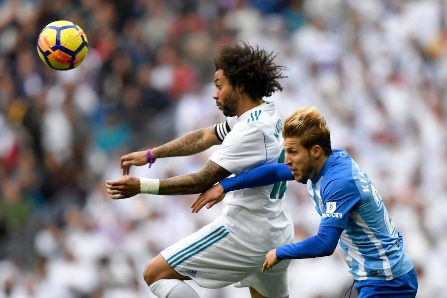 El Real Madrid venció al Málaga 3-2 en el Santiago Bernabéu. Un partido loco donde Benzema abrió la lata y Casemiro volvió a poner ventaja tras el empate de Rolan. El 'Chory' Castro volvió a poner las tablas tras un error de Kiko Casilla y Cristiano, que vio como Roberto paraba su penalti, anotaba a placer en el rechace para dar la victoria a los blancos. 