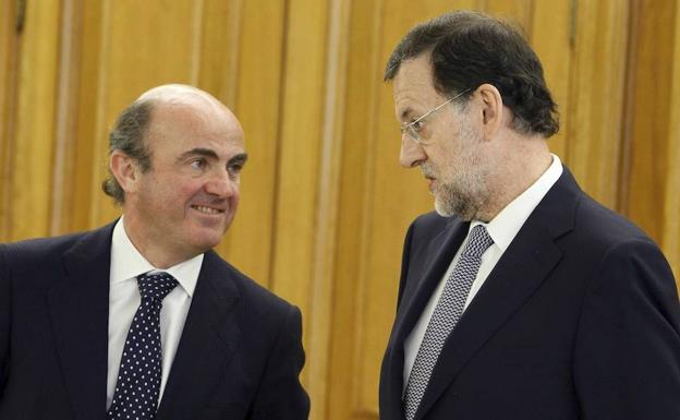 De Guindos y Rajoy.