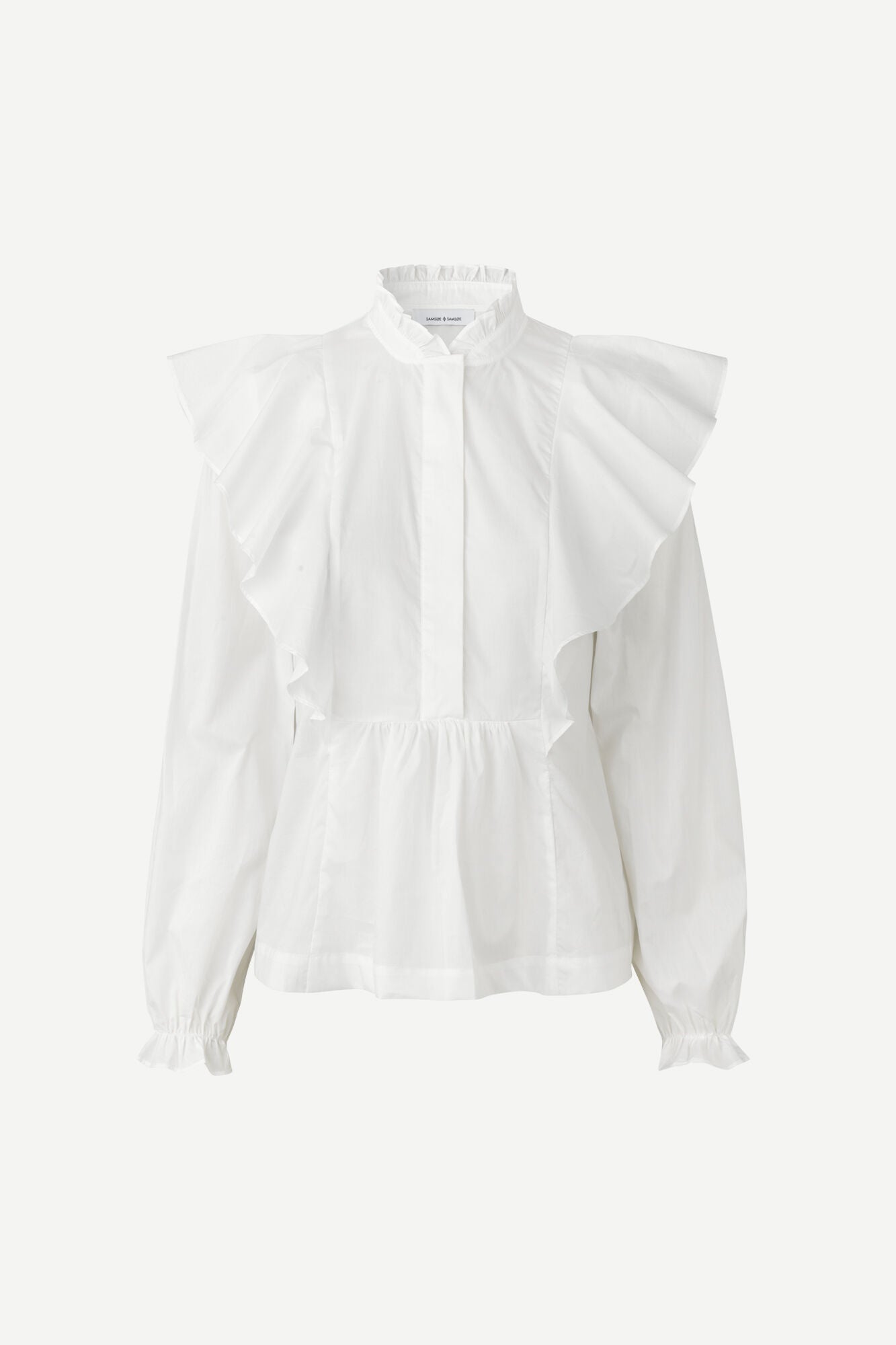 Blusa de popelín con detalles de volantes, de Samsoe Samsoe (99 euros). 