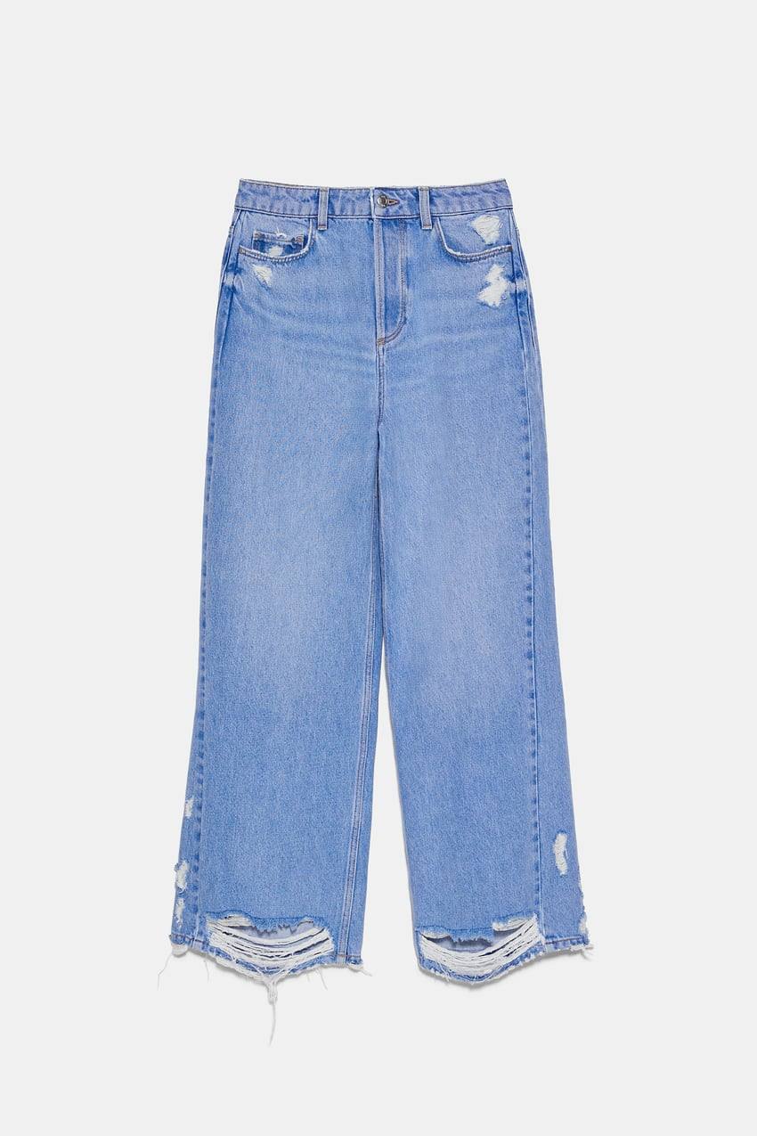 'Jeans Z1975 wide leg' con rotos en la parte delantera y en el bajo de Zara, 25,95 euros.