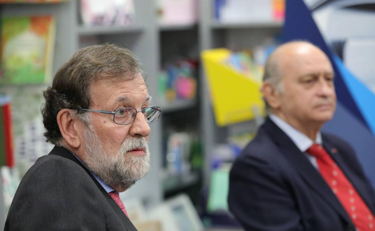 Mariano Rajoy y Jorge Fernández Díaz, en la presentación de un libro en 2019.