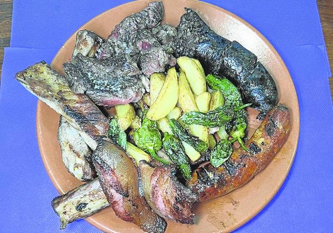 Parrillada de carne:morcilla, chorizo, costilla, panceta y picanha. dm