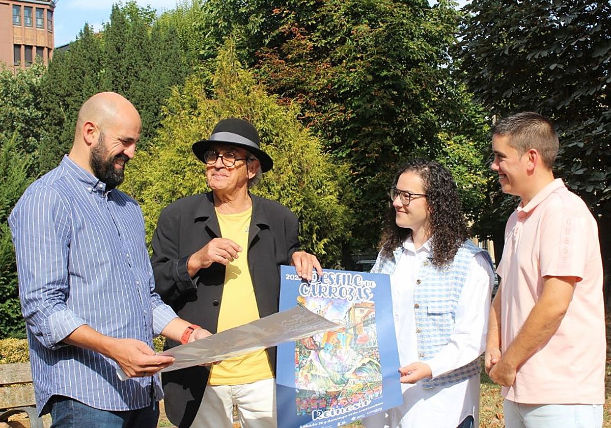 Presentación del cartel del Desfile de Carrozas en manos de su autor, Alberto Gallo.