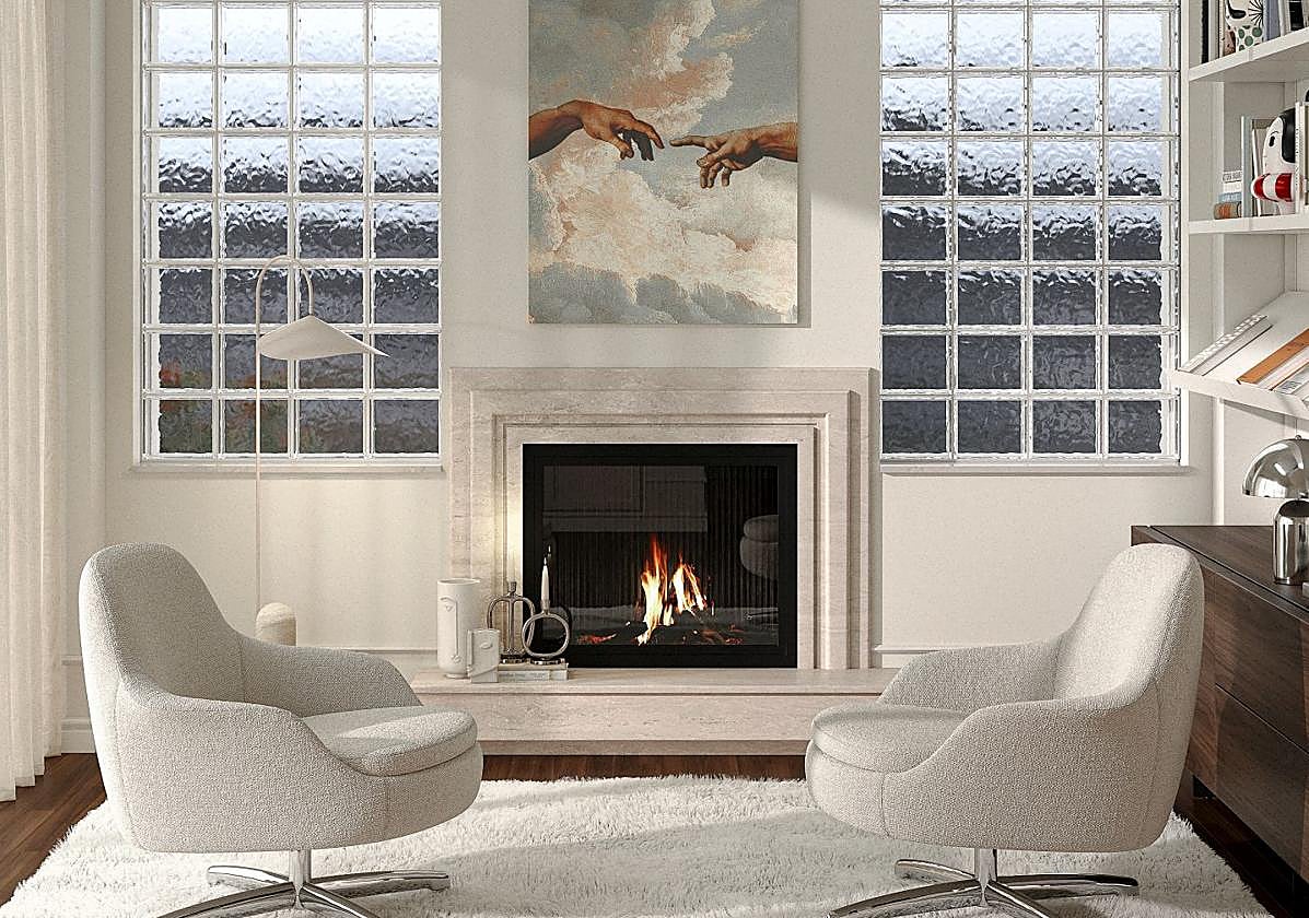 El salón está presidido por una chimenea, dos butacas tapizadas en bouclé, una gran alfombra y una reproducción de 'La creación de Adán', de Miguel Ángel.