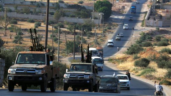 Evacuación de rebeldes y civiles de la ciudad siria de Daraya.