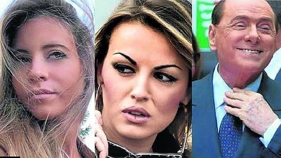 La joven Lavinia Palombini, a la izquierda, y Francesca Pascale flanquean al talludito Berlusconi. 