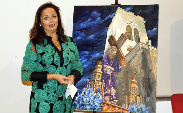 Inés Martínez González, con el cuadro del cartel.
