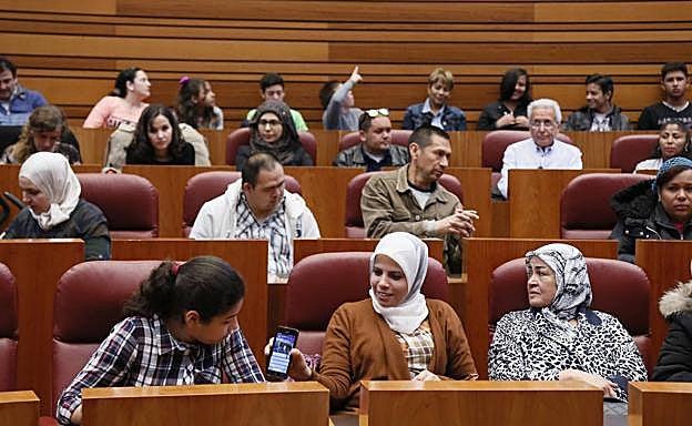 Participantes en la jornada de 'Castilla y León, Tierra de Acogida' en las Cortes de Castilla y León.