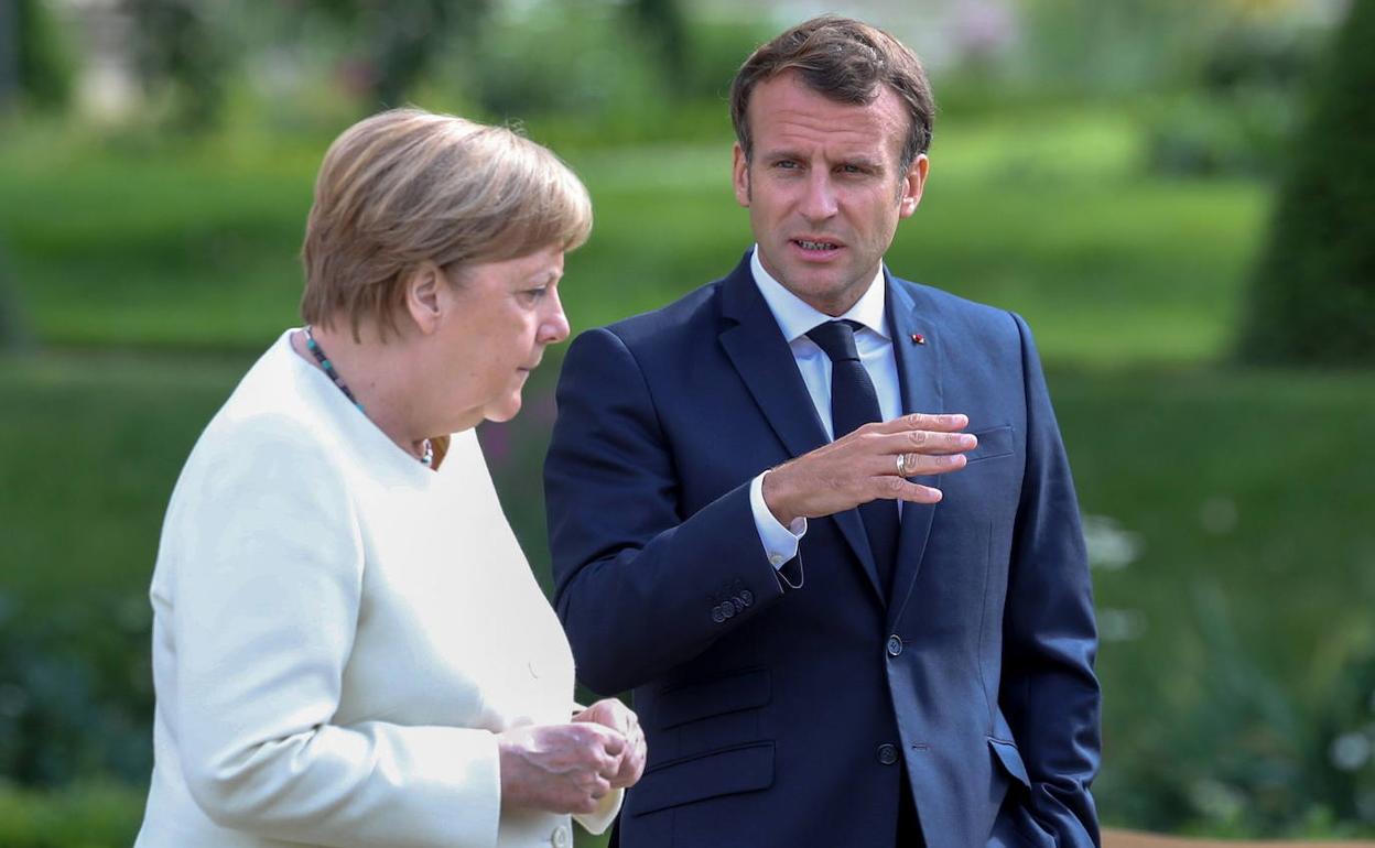 Merkel y Macron.