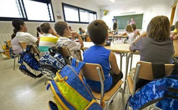 Niños en un aula antes de la pandemia.