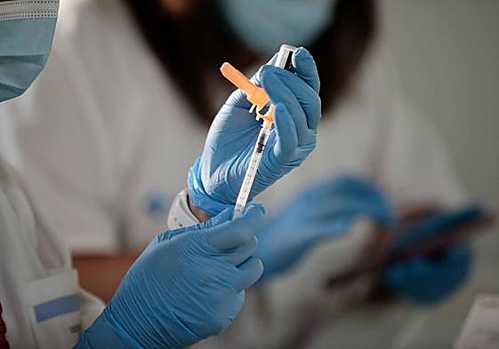 Inyección ed vacuna de la gripe.