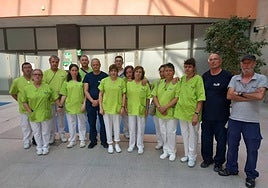 Los compañeros de Mónica Álvarez durante el minuto silencio en las instalaciones de Osga.