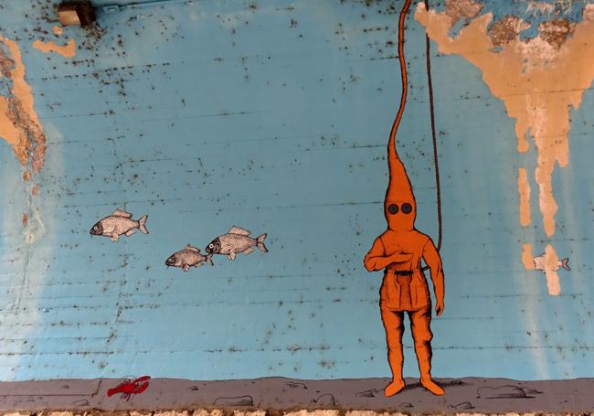 Mural bajo el Puente de Poniente en Valladolid que conmemora la gesta subacuática.