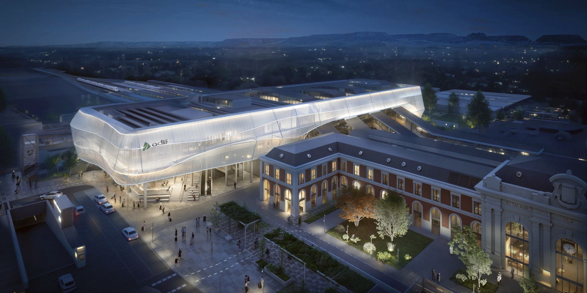 Infografía de la futura estación de trenes de Valladolid iluminada por la noche.