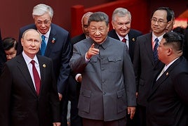 El presidente ruso, Vladimir Putin, el presidente chino, Xi Jinping, y el líder de Corea del Norte, Kim Jong Un (de izq. a der.).
