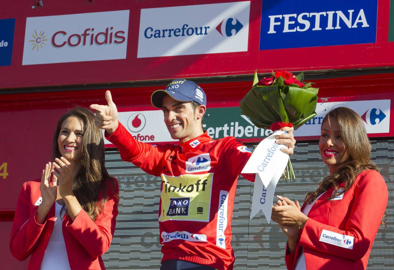 Martes 2 de septiembre: Martes, 2 de septiembre. El ciclista Alberto Contador se enfunda el maillot rojo de líder al finalizar la contrarreloj de la décima etapa de la Vuelta a España disputada entre el Real Monasterio de Santa María de Veruela y Borja, de 36,7 kilómetros. Fotos: EFE/Javier Lizón y AFP/Jaime Reina.