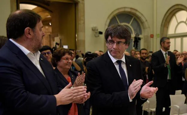 Carles Puigdemont, junto a Oriol Junqueras.