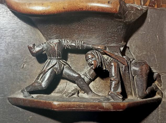 Hombre desnudando a una mujer. (Del libro 'La sillería del coro de la Catedral de Plasencia')