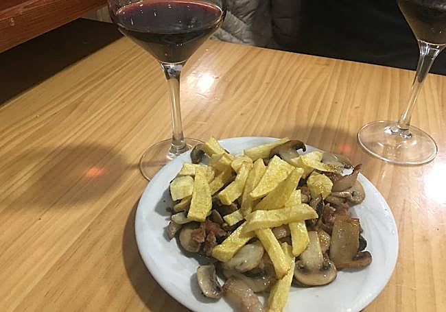 Media ración de champiñones con magro.