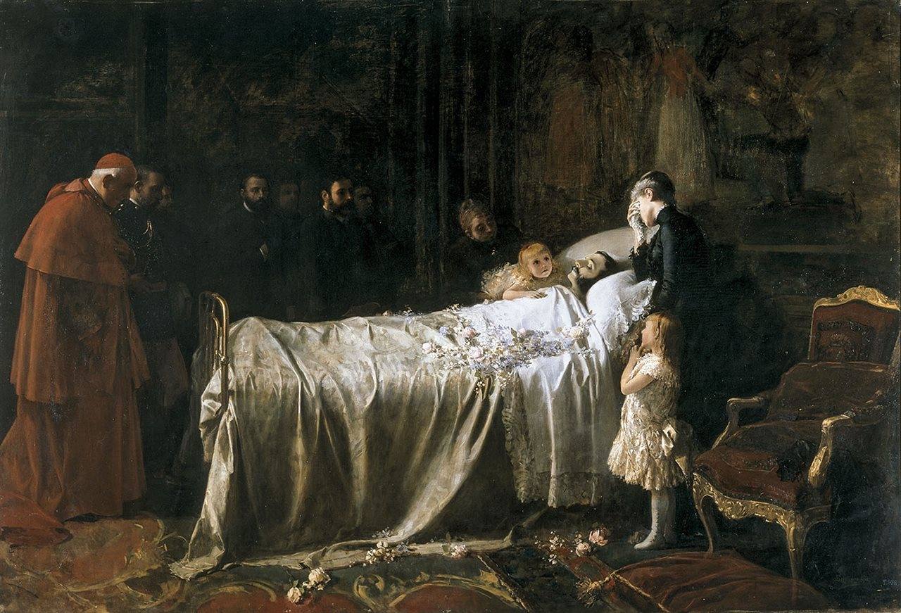 Alfonso XII murió de tuberculosis el 25 de noviembre de 1885. El cuadro de Benlliure ‘El último beso’ refleja su muerte ante la presencia de la reina embarazada y sus dos hijas legítimas.