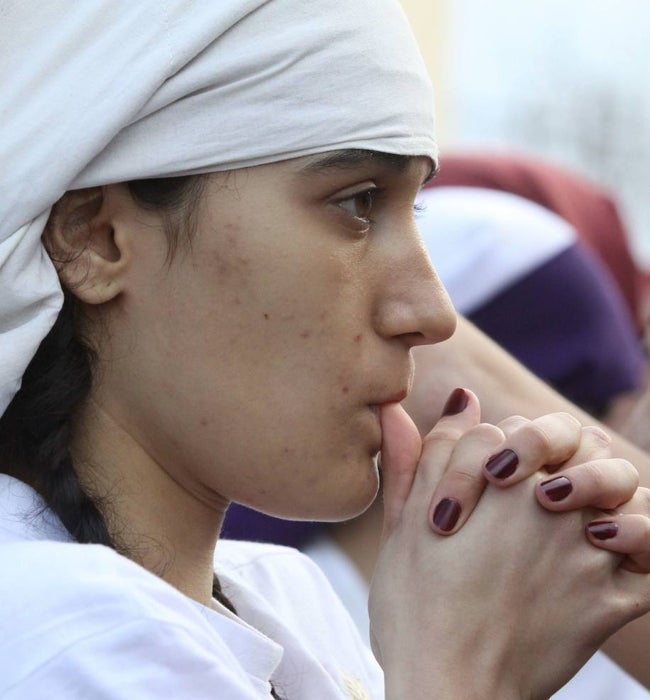 Una costalera de Mérida, inquieta en el Domingo de Ramos de 2013 ante la incertidumbre si iba a ver o no procesión.