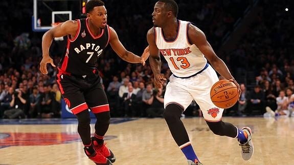 Kyle Lowry defiende a Jerian Grant.