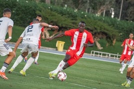 Lopy jugando contra en Marbella FC.