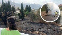 Una vecina observa el terreno quemado justo detrás de su vivienda.