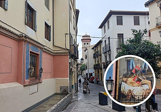 Pilar de la Virgen en calle Elvira. En el círculo, las pegatinas sobre la mampara de cristal.