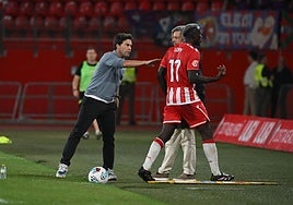 Rubi, con Dion Lopy, en el partido del pasado domingo.