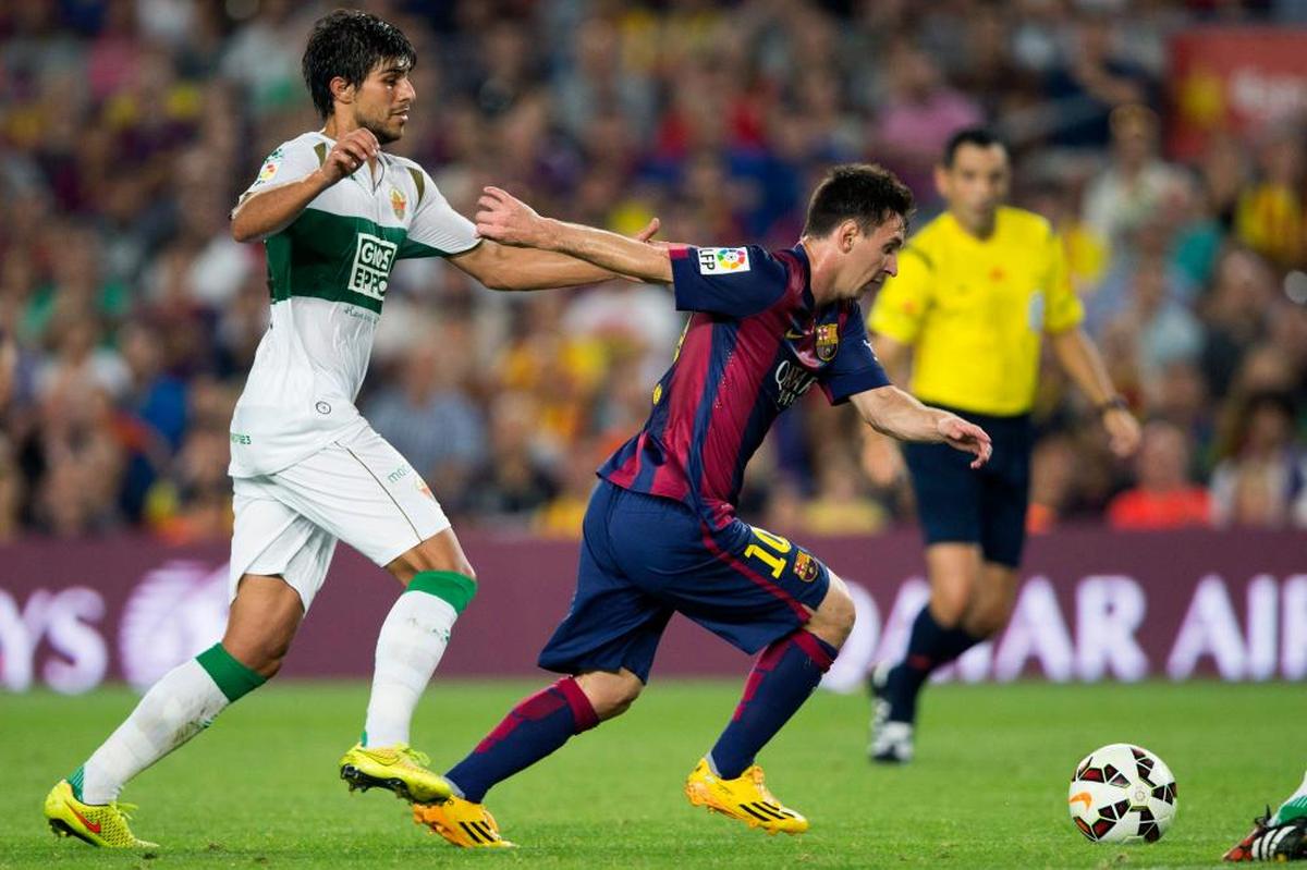 José Ángel, con Messi en la temporada 2014/15.