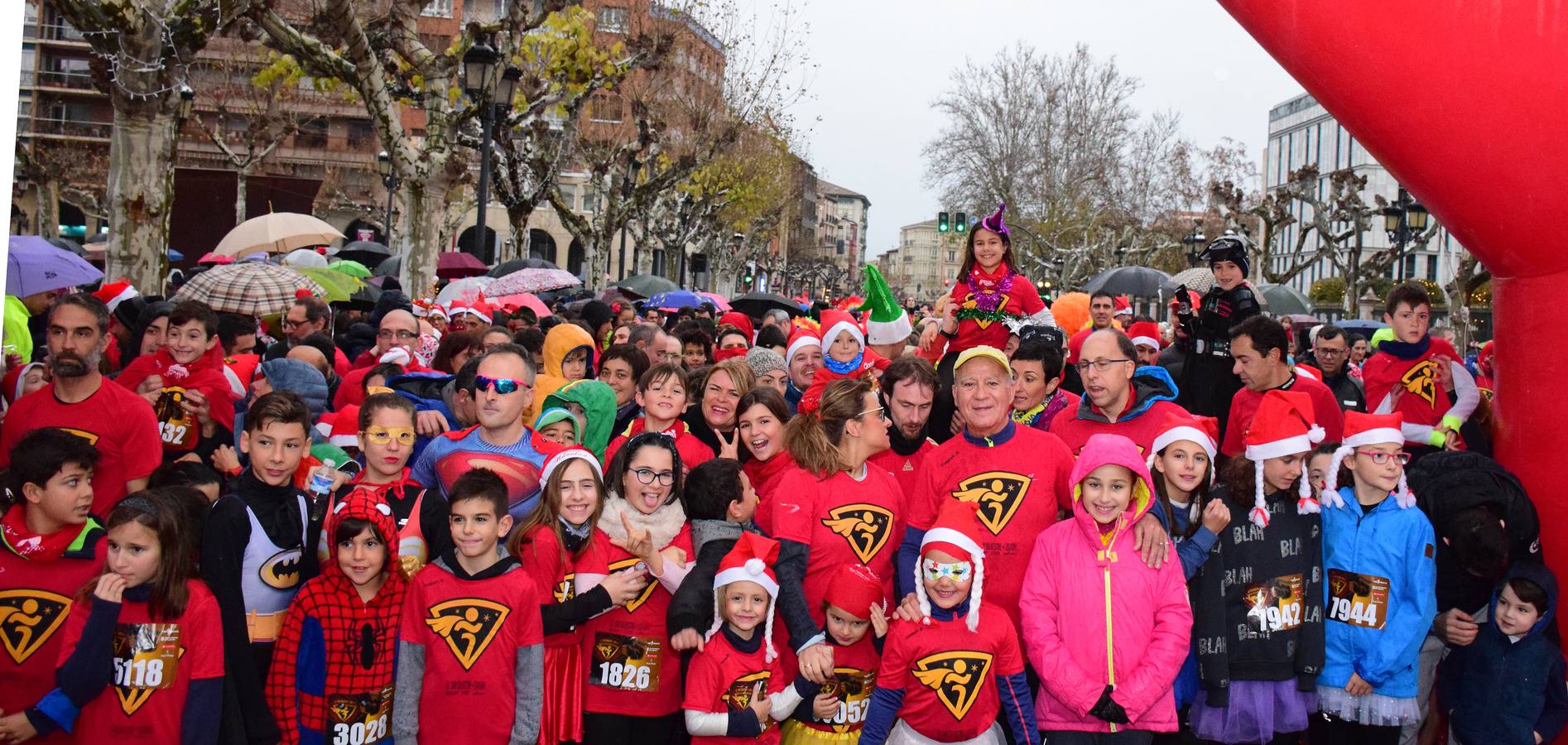 La carrera pasada por agua de papás y pequeños por las calles de la capital