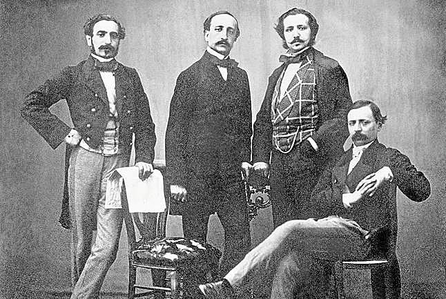 Sagasta, apoyado, junto a Ángel Fernández de los Ríos, Francisco Montemar y Pedro Calvo Asensio, sentado.