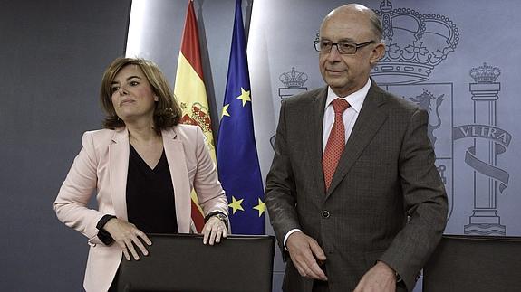 Soraya Sáenz de Santamaría y Cristóbal Montoro. 