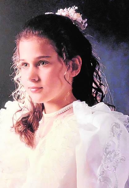 En su comunión. Los ojos azules siempre han sido su rasgo más característico. Y siempre le ha gustado ponerse delante de la cámara.