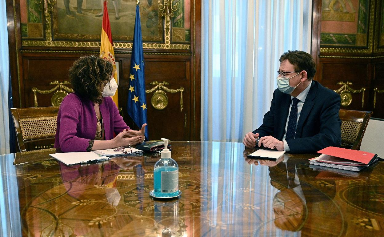 La ministra de Hacienda María Jesús Montero y el presidente Ximo Puig, en una reunión. 