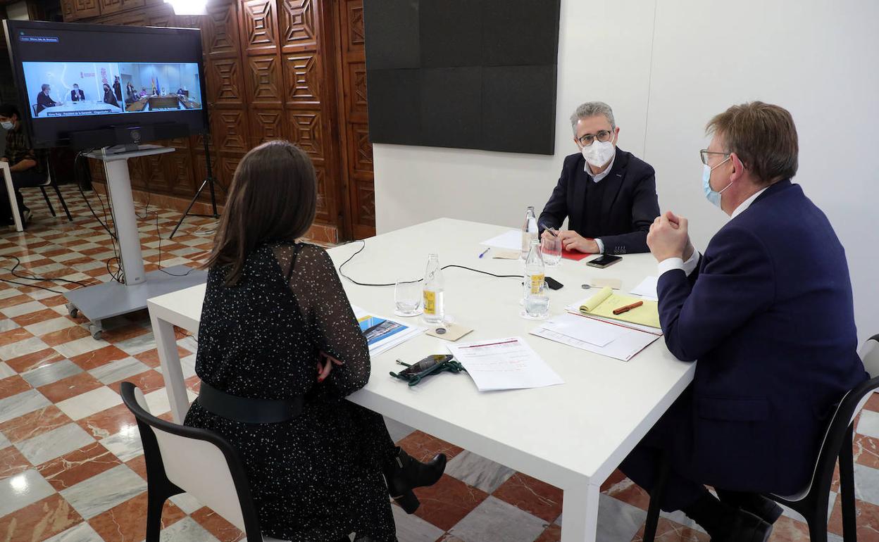 Arcadi España, Ximo Puig y María Perez, en la reunión telemática. 