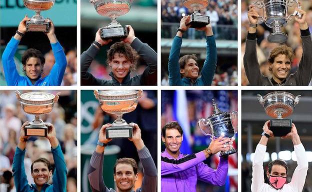 Rafa Nadal levanta algunos de sus trofeso ganados en torneos del Grand Slam. 