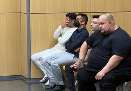 Los cuatro acusados, este lunes en el banquillo de la Ciudad de la Justicia.