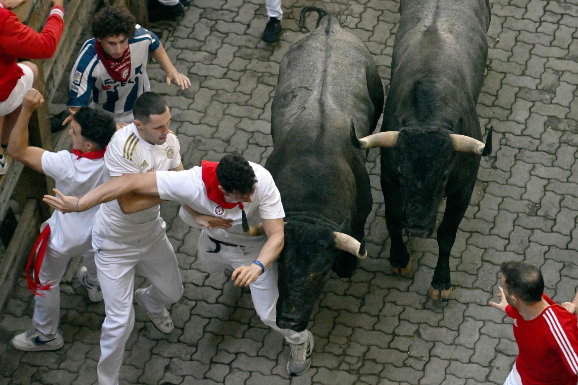 El sexto encierro de San Fermín 2025, en imágenes