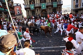 FOTOS | Séptimo encierro de San Fermín 2025