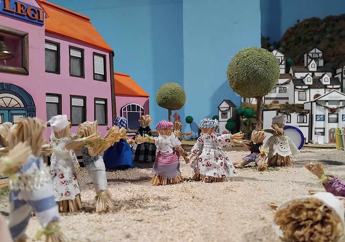Imagen principal - Personajes del belén de la falla Borrull-Turia, hechos de paja.