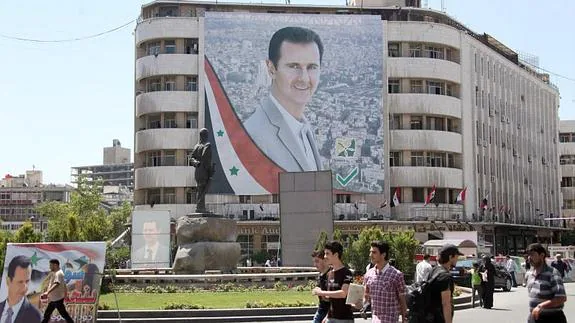 Cartel de Bashar Assad en Damasco