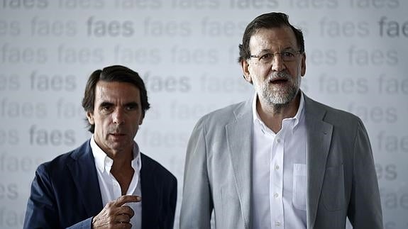 Aznar y Rajoy, en un acto de FAES.