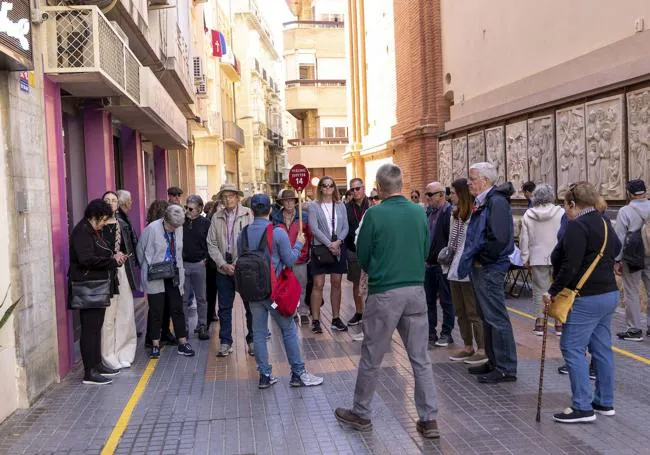 Tourists following a guide through San Miguel on Wednesday.